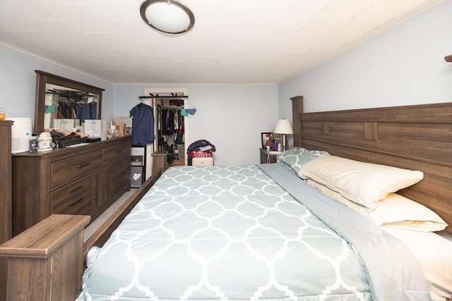 bedroom featuring crown molding