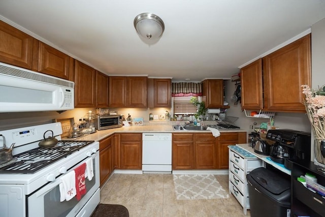 kitchen with sink and white appliances