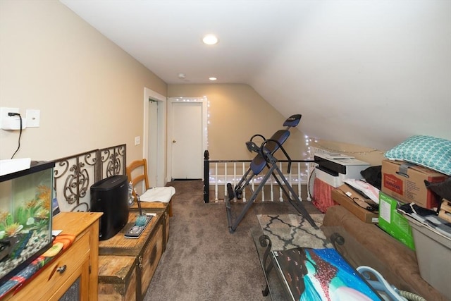 interior space with carpet floors and vaulted ceiling