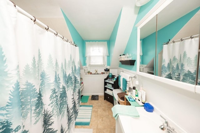 bathroom featuring a shower with shower curtain and tile patterned floors