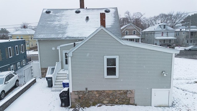 view of snow covered house