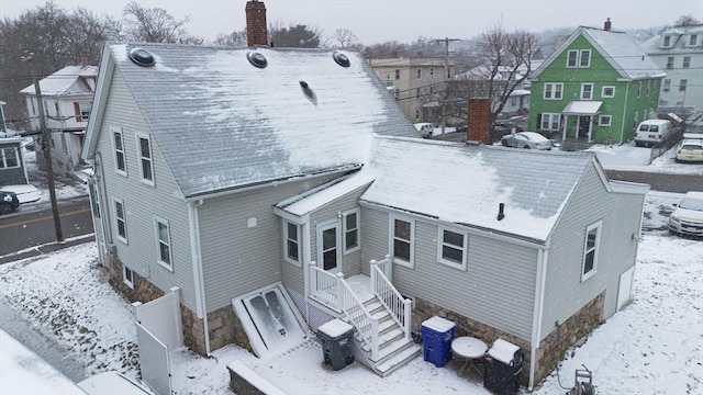 view of snow covered house