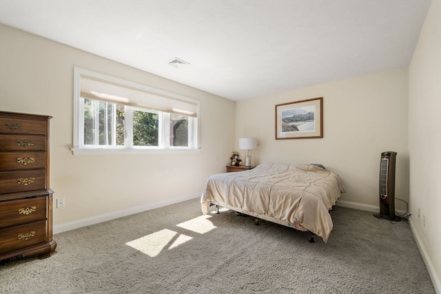 bedroom featuring light colored carpet