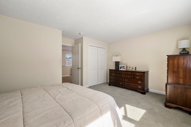 carpeted bedroom with a closet