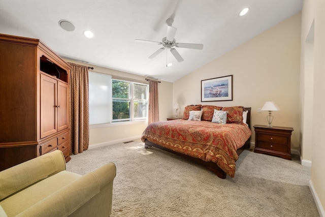 carpeted bedroom with vaulted ceiling and ceiling fan