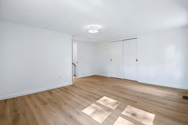 unfurnished room featuring light hardwood / wood-style floors