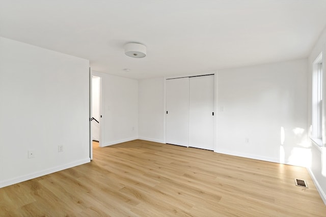 unfurnished room featuring light wood-type flooring