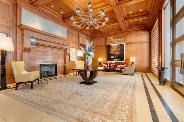 sitting room with coffered ceiling, wooden ceiling, wooden walls, beam ceiling, and an inviting chandelier