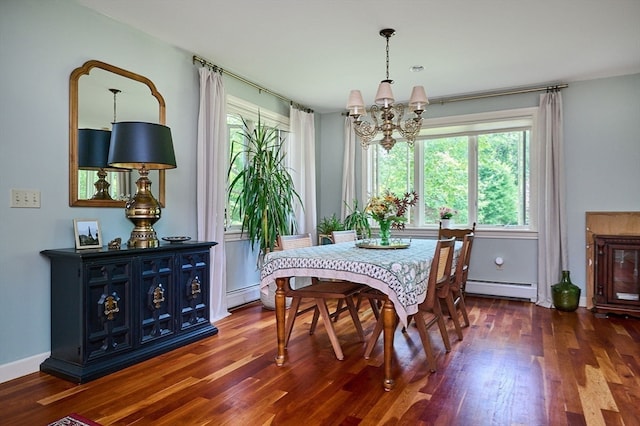 dining area with a chandelier, dark hardwood / wood-style flooring, and a baseboard heating unit