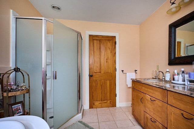 bathroom with vanity, tile patterned floors, and an enclosed shower