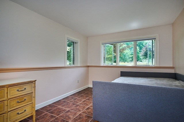 interior space featuring dark tile patterned flooring