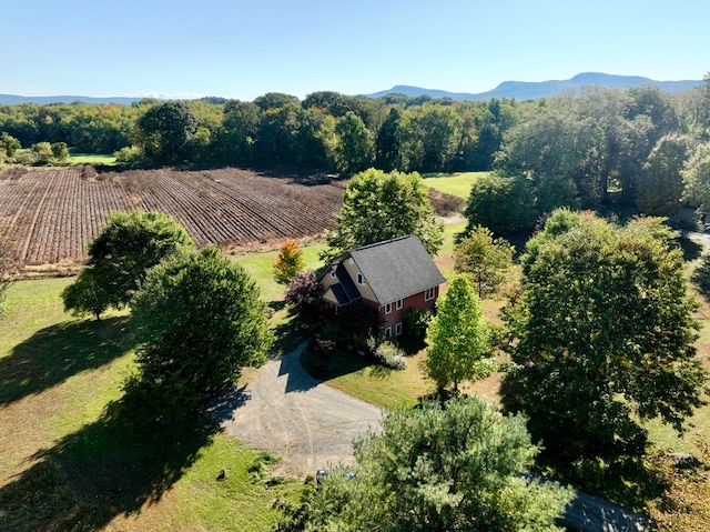 drone / aerial view featuring a mountain view and a rural view