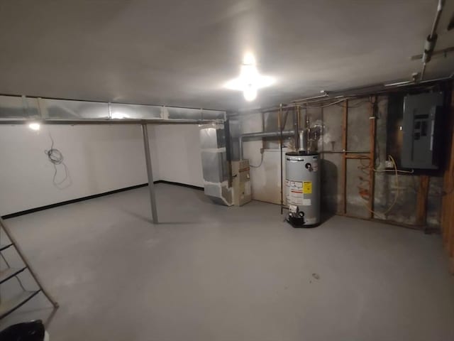 basement with electric panel, gas water heater, and heating unit