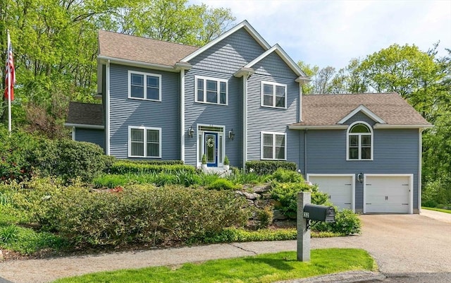32 Erins Way, Holden, MA 01520 - view of front of house featuring asphalt driveway, an attached garage, and roof with shingles