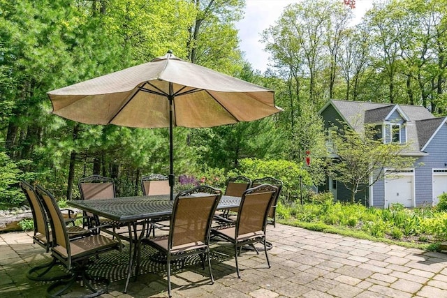 32 Erins Way, Holden, MA 01520 - view of patio featuring outdoor dining space and view of wooded area