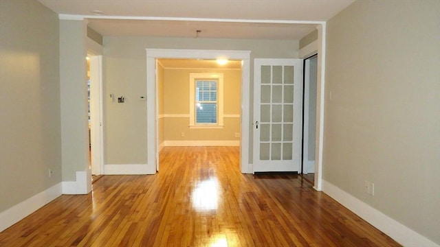 spare room featuring hardwood / wood-style floors