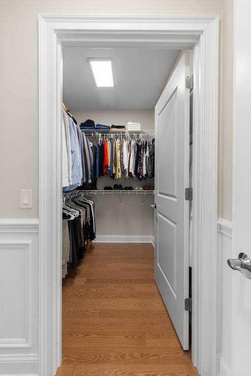 walk in closet featuring light wood-style flooring