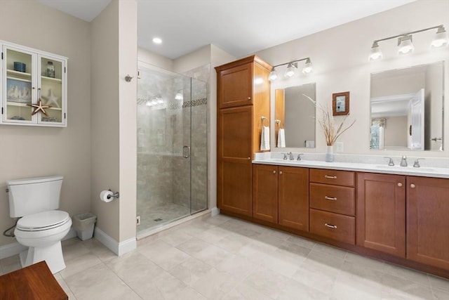 full bathroom with a stall shower, toilet, double vanity, and a sink