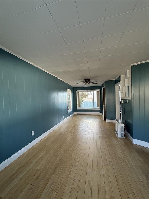 interior space with light hardwood / wood-style flooring and ceiling fan