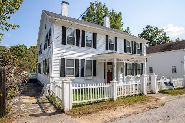 colonial-style house featuring a porch