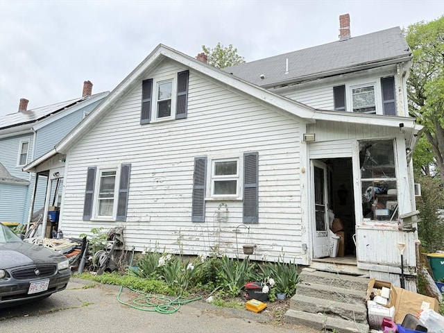 19 Davis St, Woburn, MA 01801 - view of front facade featuring a chimney