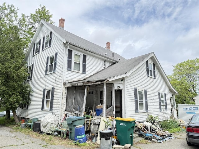 19 Davis St, Woburn, MA 01801 - view of front of property with a chimney and roof with shingles