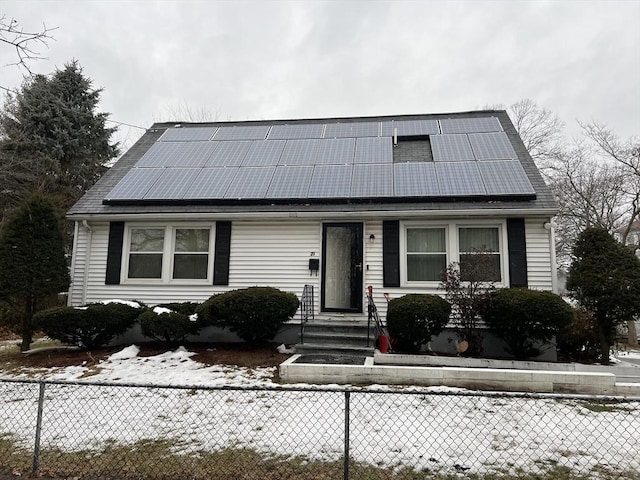 view of front of house with solar panels