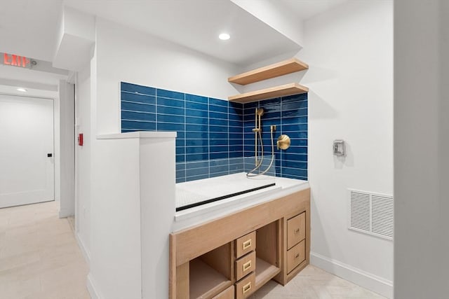 bathroom with tile patterned floors and walk in shower