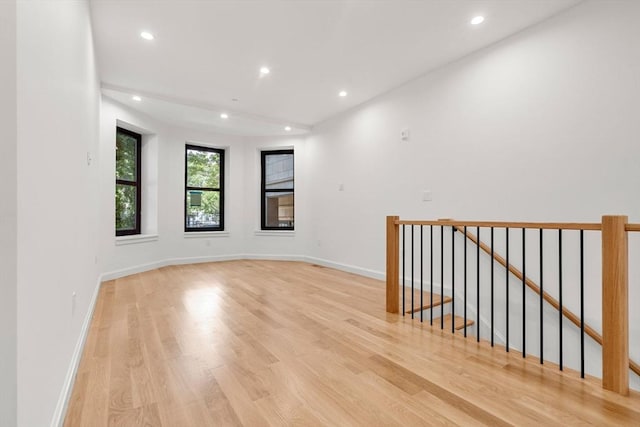 empty room with light hardwood / wood-style floors