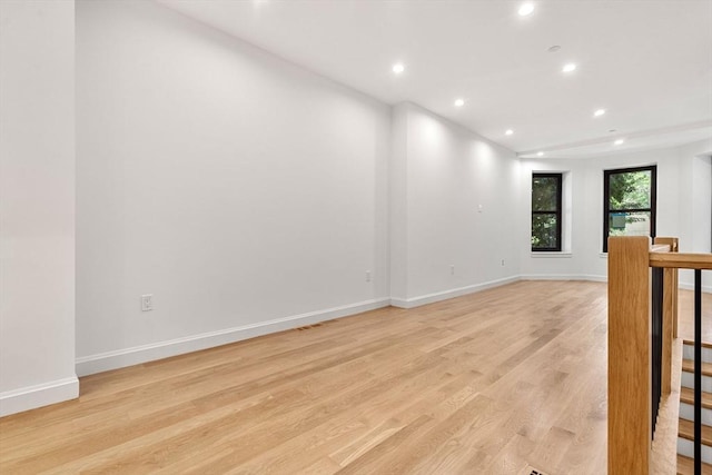 spare room featuring light hardwood / wood-style flooring