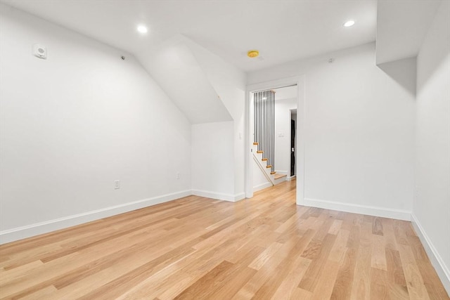 additional living space featuring light wood-type flooring