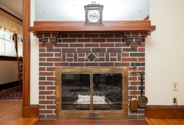 47 Ronald Rd, Arlington, MA 02474 - detailed view of a fireplace, wood finished floors, and baseboards