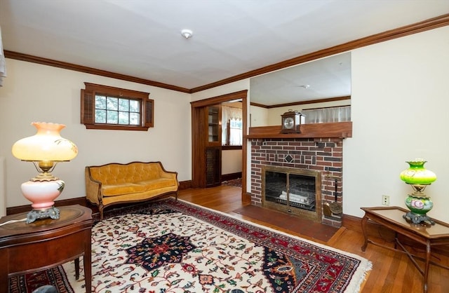 47 Ronald Rd, Arlington, MA 02474 - living room featuring wood-type flooring, a fireplace, healthy amount of natural light, baseboards, and ornamental molding