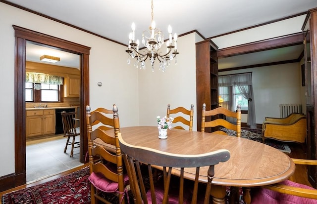 47 Ronald Rd, Arlington, MA 02474 - dining space with radiator heating unit, crown molding, a chandelier, and plenty of natural light