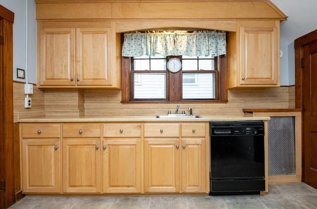 47 Ronald Rd, Arlington, MA 02474 - kitchen featuring black dishwasher, a sink, light brown cabinetry, and light countertops