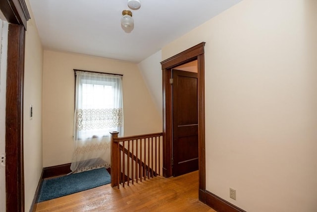47 Ronald Rd, Arlington, MA 02474 - hallway with an upstairs landing, light wood finished floors, and baseboards