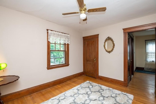 47 Ronald Rd, Arlington, MA 02474 - bedroom featuring baseboards, light wood finished floors, and a ceiling fan