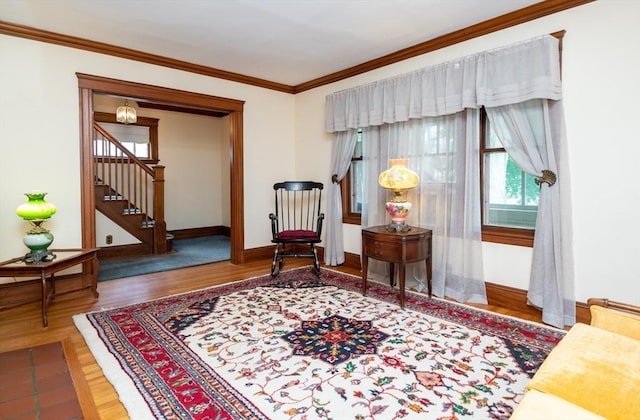 47 Ronald Rd, Arlington, MA 02474 - sitting room featuring wood finished floors, stairs, crown molding, and baseboards