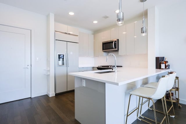 65 Lewis St Unit Ph03, Boston, MA 02128 - kitchen with built in refrigerator, stainless steel microwave, a peninsula, and modern cabinets