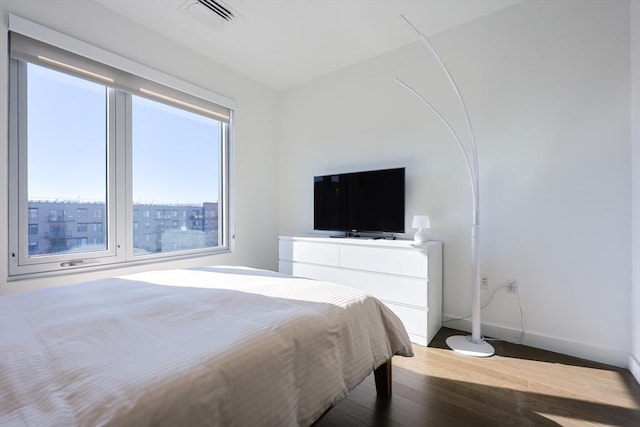 65 Lewis St Unit Ph03, Boston, MA 02128 - bedroom featuring visible vents, baseboards, and wood finished floors