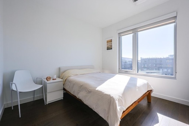 65 Lewis St Unit Ph03, Boston, MA 02128 - bedroom with dark wood-style floors and baseboards