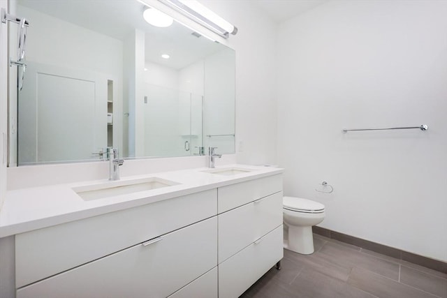 65 Lewis St Unit Ph03, Boston, MA 02128 - bathroom with toilet, a stall shower, double vanity, and a sink