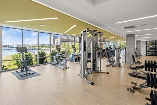 65 Lewis St Unit Ph03, Boston, MA 02128 - gym with wood finished floors, floor to ceiling windows, visible vents, and plenty of natural light