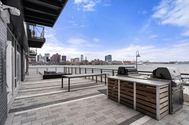 65 Lewis St Unit Ph03, Boston, MA 02128 - view of patio / terrace featuring a water view, a grill, and a city view