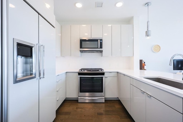 65 Lewis St Unit Ph03, Boston, MA 02128 - kitchen featuring light countertops, visible vents, modern cabinets, appliances with stainless steel finishes, and a sink