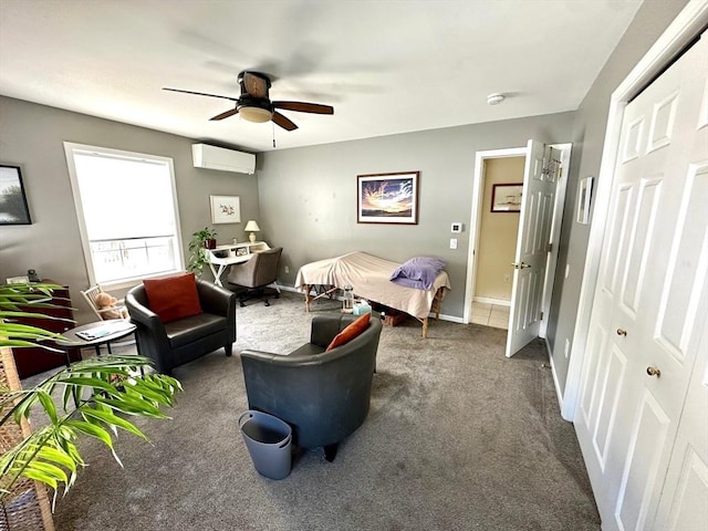 bedroom featuring ceiling fan, baseboards, dark colored carpet, and a wall mounted AC