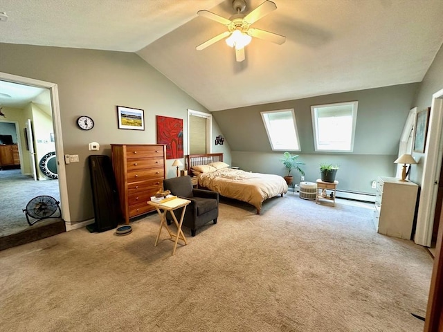 bedroom with a baseboard heating unit, light carpet, vaulted ceiling, and ceiling fan