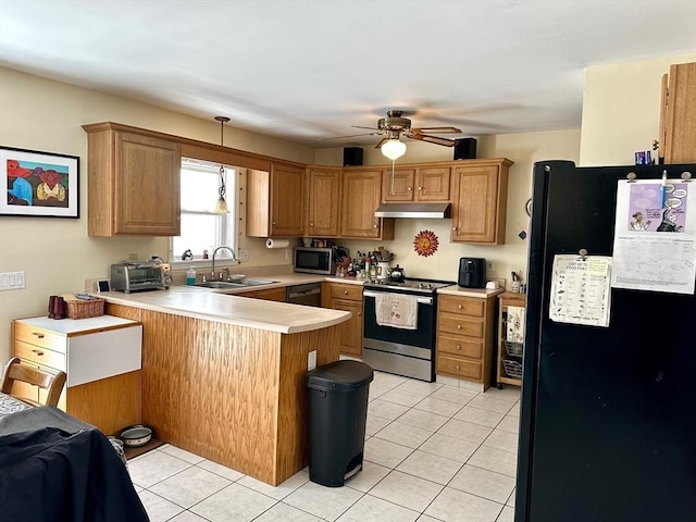 kitchen featuring appliances with stainless steel finishes, light tile patterned flooring, a sink, a peninsula, and under cabinet range hood