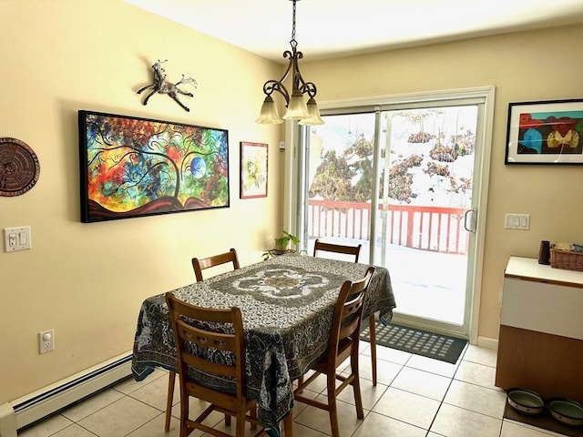 dining room featuring a baseboard heating unit, light tile patterned flooring, and baseboards