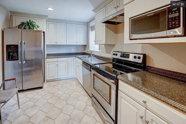 kitchen with white cabinetry, appliances with stainless steel finishes, and sink